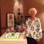 Heidi at her book launch party complete with book shrine and cake.